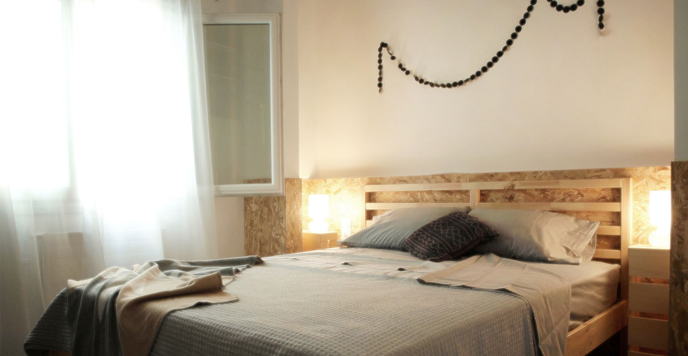 Urban interior design with indirect lighting behind osb headboard