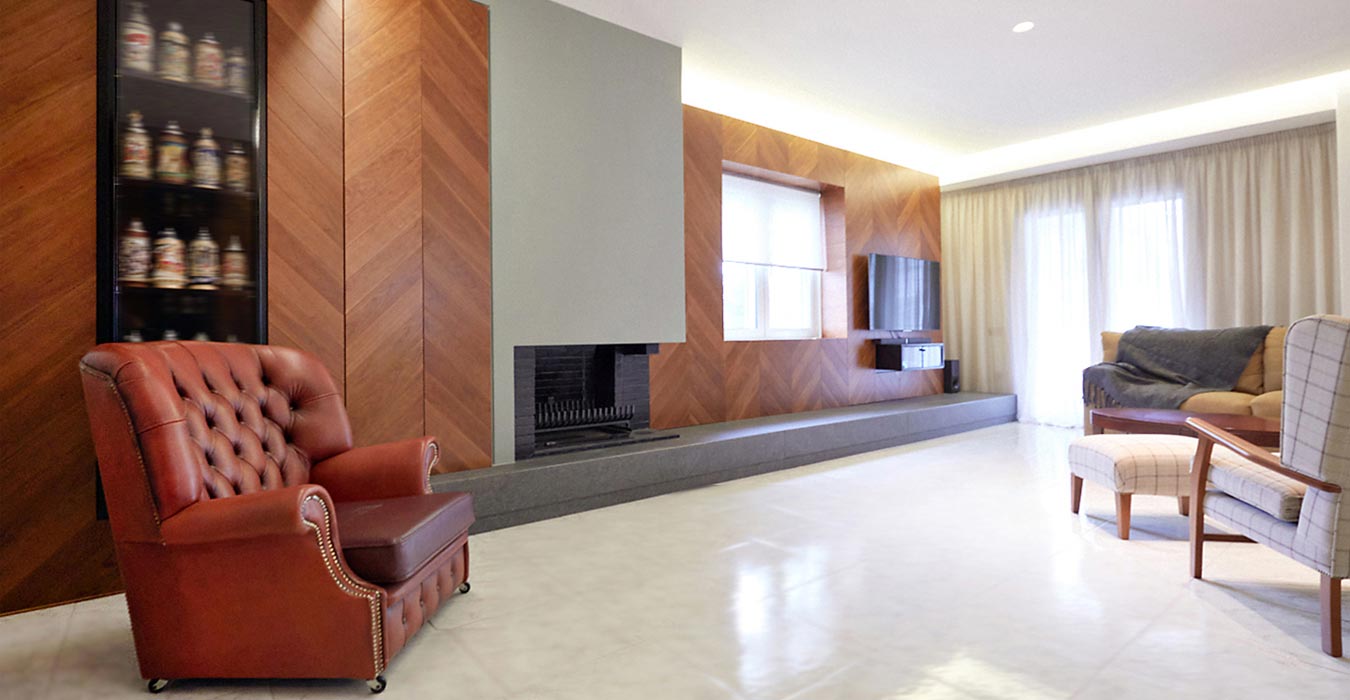 3. A longitudinal herringbone wood structure contains show cases, hidden storage cupboards, audiovisual devices and the fireplace.