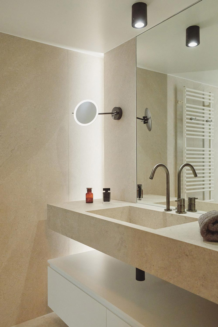 Detail of a magnifying wall mirror.