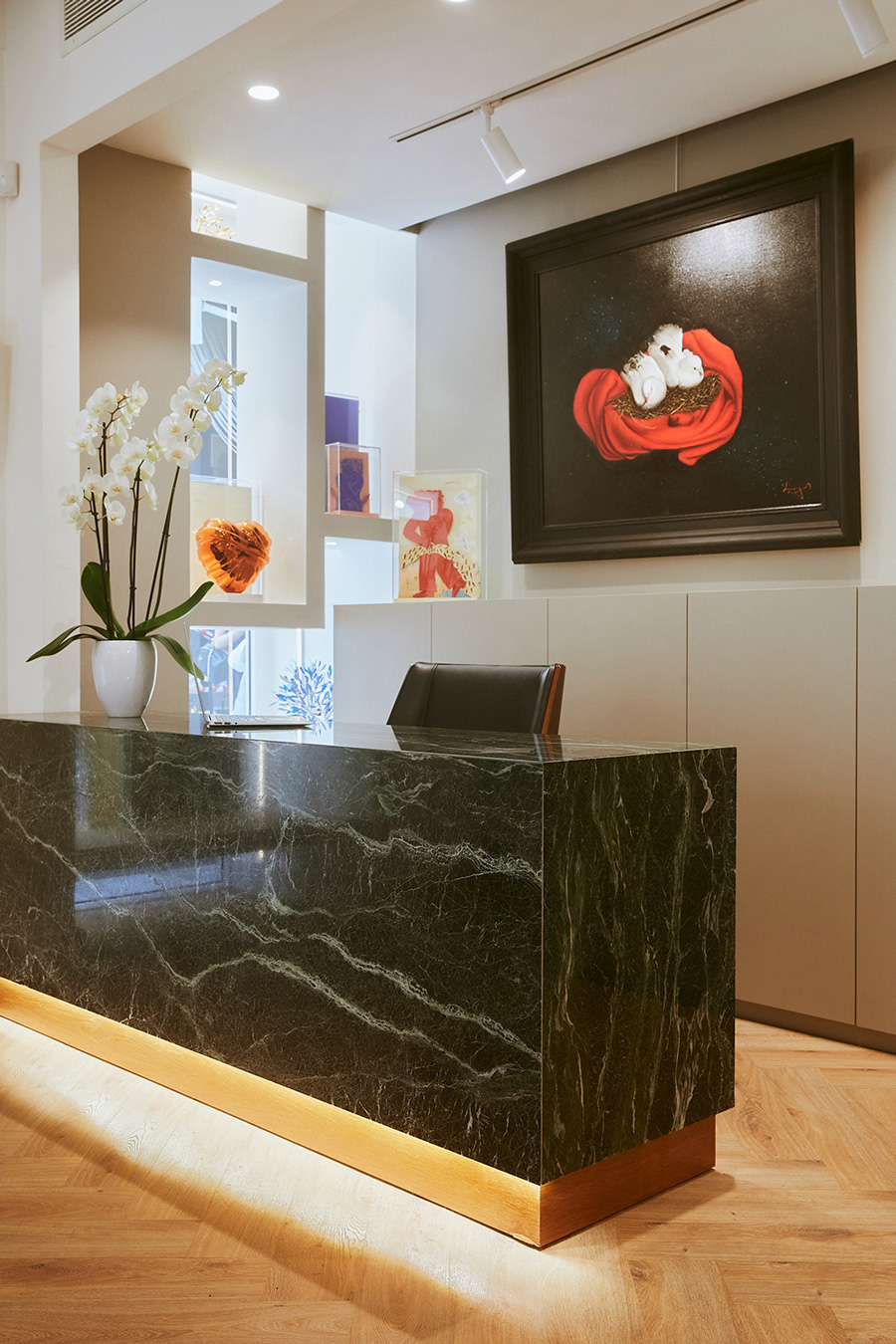 Green marble desk and grey wall