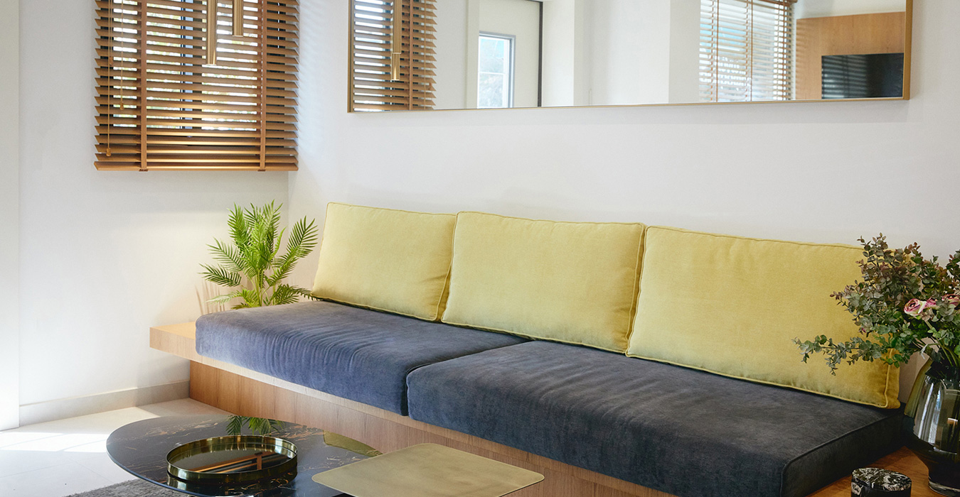 Built- in oak veneer sofa in the waiting area