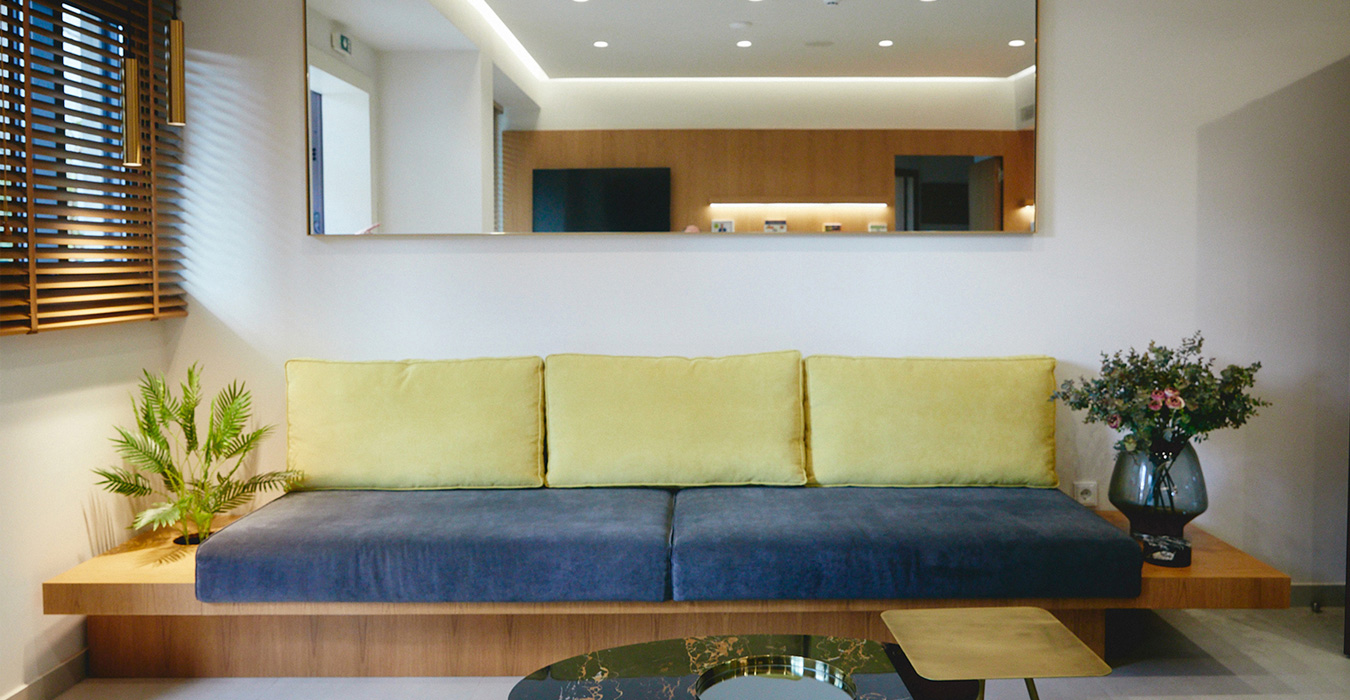 Built- in oak veneer sofa in the waiting area