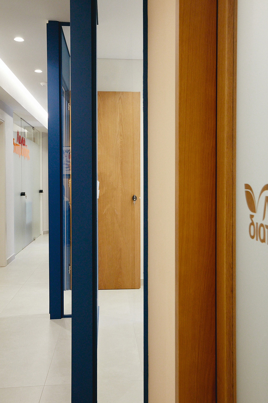 Narrow glass openings define the wall’ s corner