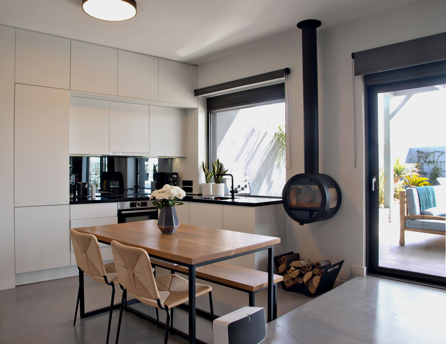 White minimal open space kitchen.