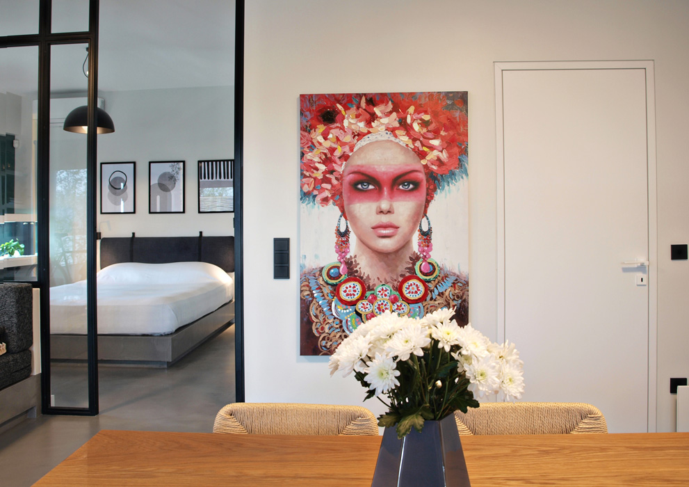 Modern glass partition between bedroom and living room.