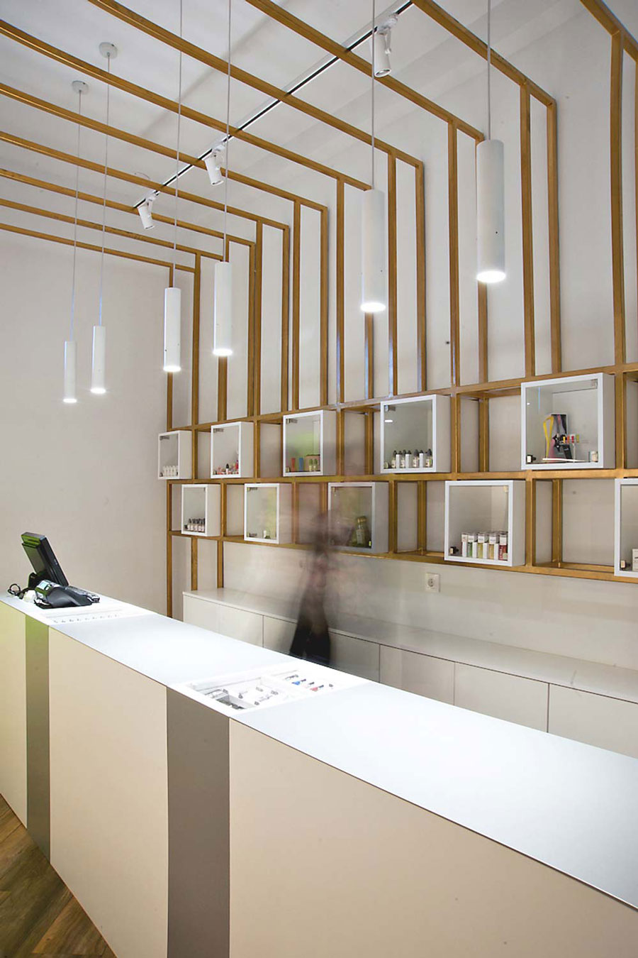 Metal structure behind the cashier furniture.