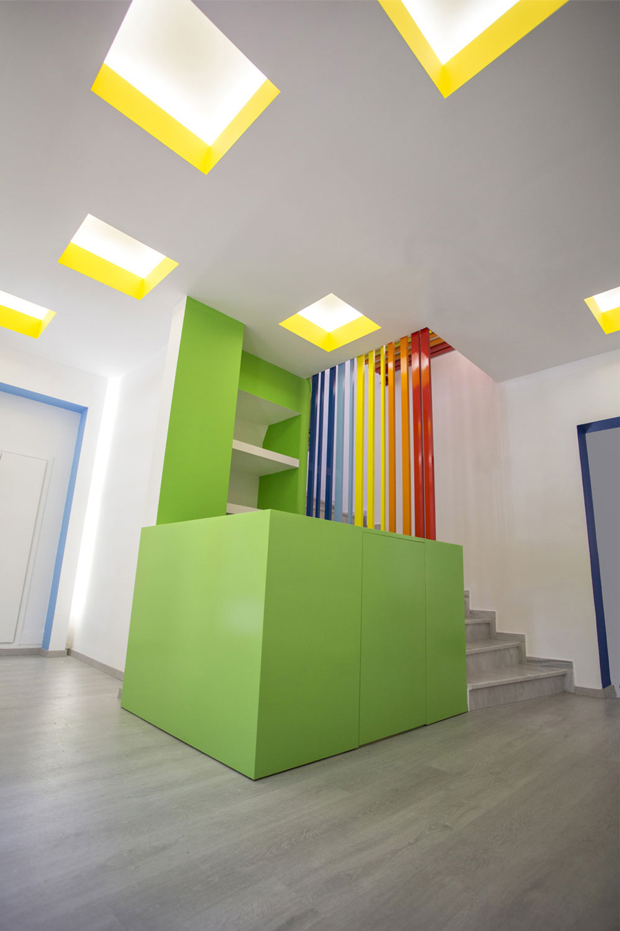 Green lacquered reception furniture with bright colored tubes