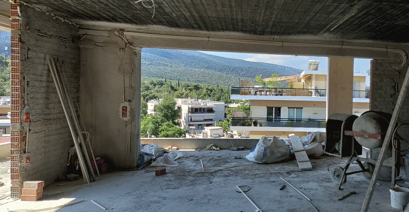 The bookcase hides the fan coil at its base.